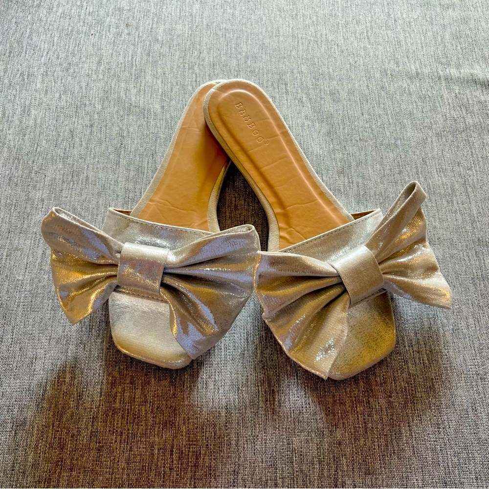 WORN ONCE SILVER SLIDE SANDALS WITH BOWS